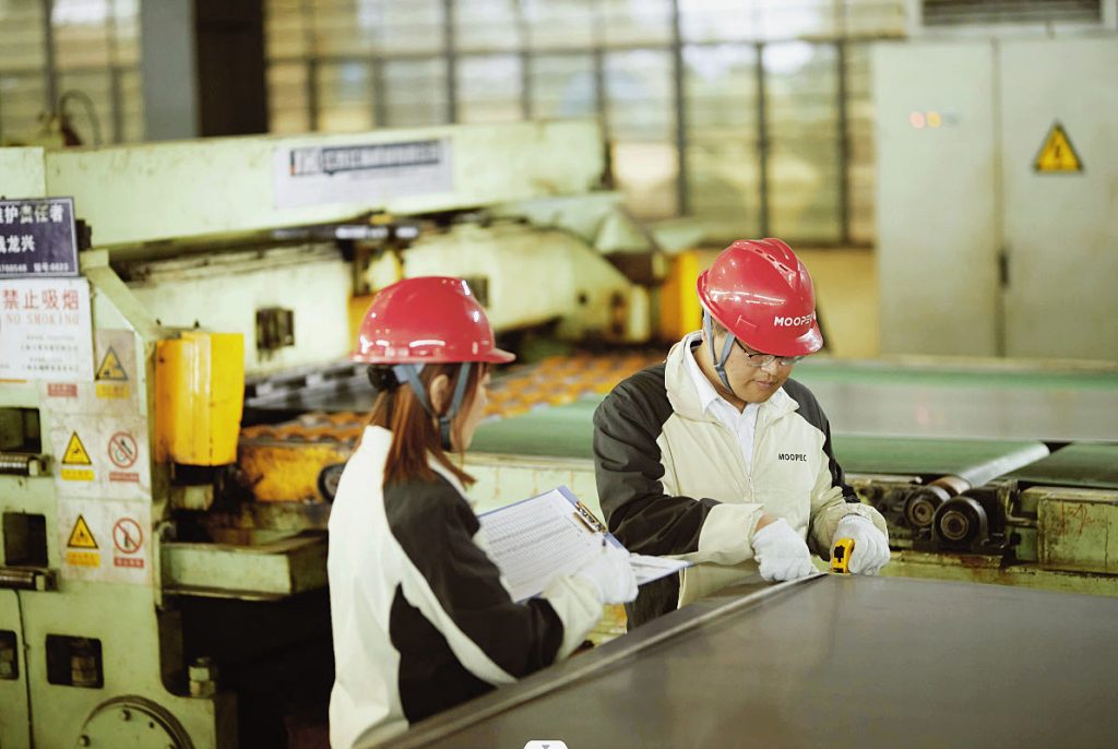MOOPEC workers at slitting line