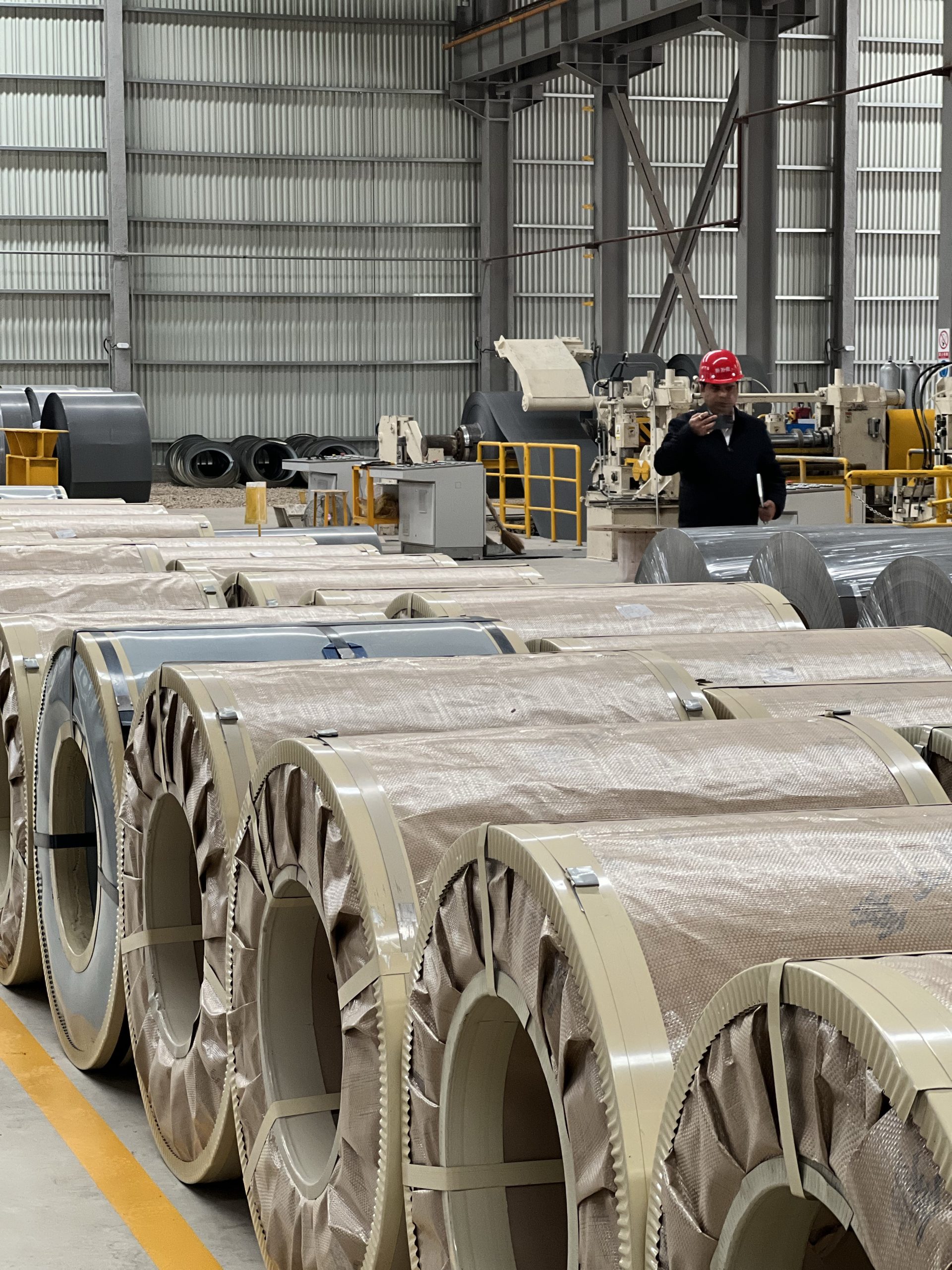 Packaged steel coils in warehouse